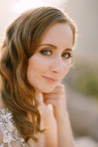 Smiling face of the fair-haired bride. Close-up